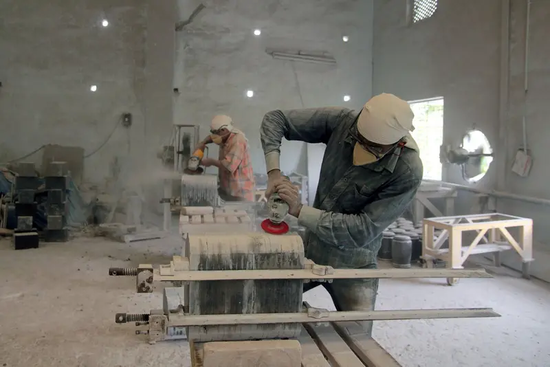 Hand finishing a stone piece